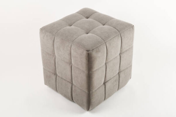 Soft beige pouf on a white background.